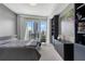Comfortable bedroom featuring built-in storage and city views from large windows at 3325 Piedmont Ne Rd # 3005, Atlanta, GA 30305
