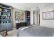 Cozy main bedroom with carpet, art, and built-in shelving at 3325 Piedmont Ne Rd # 3005, Atlanta, GA 30305