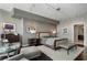 Comfortable main bedroom with a gray color scheme, dark wood floors, and a sitting area at 3325 Piedmont Ne Rd # 3005, Atlanta, GA 30305