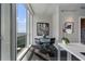 Office nook with expansive city views, complemented by modern lighting, and stylish, minimalist decor at 3325 Piedmont Ne Rd # 3005, Atlanta, GA 30305