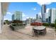 Enjoy the patio area with lovely plantings and views of the city skyline at 3325 Piedmont Ne Rd # 3005, Atlanta, GA 30305