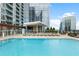Relaxing condominium community pool with lounge chairs and covered seating at 3325 Piedmont Ne Rd # 3005, Atlanta, GA 30305