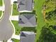 Top-down view of a house with dark gray roof, surrounded by green lawn and neighboring homes at 411 Riverclub Rd, Acworth, GA 30101