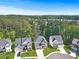 Stunning aerial view of suburban homes near a lush forest and peaceful lake at 411 Riverclub Rd, Acworth, GA 30101