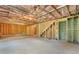 Spacious unfinished basement with exposed insulation, wood framing, and potential for future customization at 411 Riverclub Rd, Acworth, GA 30101