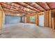 Unfinished basement with exposed wood framing and concrete floor, offering potential for customization at 411 Riverclub Rd, Acworth, GA 30101