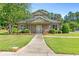Beautiful craftsman-style community clubhouse with lush green landscape at 411 Riverclub Rd, Acworth, GA 30101
