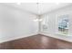 Dining room with hardwood floors and plenty of natural light from two windows at 411 Riverclub Rd, Acworth, GA 30101