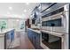 Gourmet kitchen featuring stainless steel appliances, modern cabinetry, granite countertops and an open layout at 411 Riverclub Rd, Acworth, GA 30101