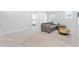 Comfortable living room with a gray sofa, stylish coffee table, and plush carpeting at 411 Riverclub Rd, Acworth, GA 30101