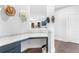 Cozy mudroom with a built-in desk, storage cabinets, and decorative hats for a touch of rustic charm at 411 Riverclub Rd, Acworth, GA 30101