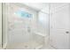 Walk-in shower featuring marble tile and a shower bench at 411 Riverclub Rd, Acworth, GA 30101