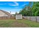 Spacious backyard with wooden fence and storage shed at 4575 Birch Way, Loganville, GA 30052