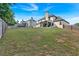 Spacious backyard with a trampoline and ample green space for activities at 4575 Birch Way, Loganville, GA 30052