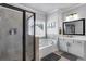 Luxurious bathroom featuring a glass-enclosed shower and a soaking tub next to a window at 4575 Birch Way, Loganville, GA 30052