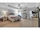 Spacious bedroom with a cozy seating area, dresser, and comfortable king size bed at 4575 Birch Way, Loganville, GA 30052