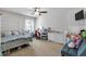 Charming bedroom featuring a canopy bed and plenty of natural light at 4575 Birch Way, Loganville, GA 30052