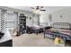 Bedroom with two beds, a ceiling fan, and decorative shelving for personal items at 4575 Birch Way, Loganville, GA 30052