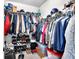 Organized walk-in closet filled with clothes, shoes, and accessories on shelves and racks at 4575 Birch Way, Loganville, GA 30052