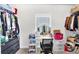 Functional walk-in closet with a vanity area, ideal for storage and organization at 4575 Birch Way, Loganville, GA 30052