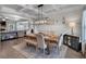 Dining room has coffered ceiling, contemporary decor, hardwood floors and a large table perfect for Gathering dining at 4575 Birch Way, Loganville, GA 30052
