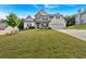 Beautiful two story home with a manicured lawn on a large lot with an attached two car garage at 4575 Birch Way, Loganville, GA 30052