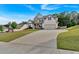 Two-story home featuring a manicured lawn, stone accents, and an attached two-car garage at 4575 Birch Way, Loganville, GA 30052