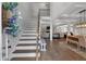 Bright foyer showcasing a staircase, hardwood floors, and views into the living spaces at 4575 Birch Way, Loganville, GA 30052