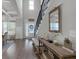 Sun-filled foyer featuring hardwood floors, staircase and decor at 4575 Birch Way, Loganville, GA 30052