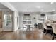 Bright kitchen features stainless appliances, granite countertops, a breakfast bar island and sun-filled eat-in area at 4575 Birch Way, Loganville, GA 30052