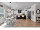 Open kitchen features granite countertops, stainless appliances, large island and eat-in area with bright lighting at 4575 Birch Way, Loganville, GA 30052