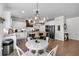 Bright kitchen offers stainless appliances, granite countertops, and eat-in area with plenty of room for entertaining at 4575 Birch Way, Loganville, GA 30052
