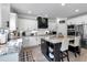 Beautiful kitchen features granite countertops, stainless appliances, spacious center island with breakfast bar and modern accents at 4575 Birch Way, Loganville, GA 30052