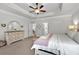 Light and bright main bedroom with tray ceiling, ceiling fan, and neutral colors at 4575 Birch Way, Loganville, GA 30052