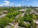 Scenic aerial view showing mature tree cover, residential homes and the Atlanta skyline in the background at 957 Harwell Nw St, Atlanta, GA 30314