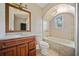 Bathroom featuring single sink vanity, toilet and tiled tub/shower at 957 Harwell Nw St, Atlanta, GA 30314