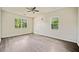 Empty bedroom features wood-look laminate flooring and two windows at 957 Harwell Nw St, Atlanta, GA 30314
