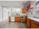 View of the kitchen area, showing the countertops, wooden cabinets, and new floors at 957 Harwell Nw St, Atlanta, GA 30314
