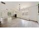 Open concept living room with great light, fireplace, updated floors and a pass through to the kitchen at 957 Harwell Nw St, Atlanta, GA 30314