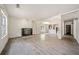 Bright living room featuring a fireplace, gray wood flooring and ample natural light at 957 Harwell Nw St, Atlanta, GA 30314