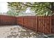 Fenced backyard with a concrete patio area surrounded by mature trees at 4701 Flat Shoals Rd # 35E, Union City, GA 30291