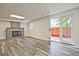 Finished basement showcasing a classic brick fireplace and sliding glass doors to the outdoor patio at 4701 Flat Shoals Rd # 35E, Union City, GA 30291