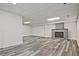 Spacious finished basement features modern flooring, a brick fireplace, and neutral walls at 4701 Flat Shoals Rd # 35E, Union City, GA 30291