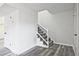 Bright entryway with freshly painted walls, new hardwood floors, and staircase at 4701 Flat Shoals Rd # 35E, Union City, GA 30291