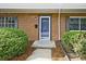Close up of a front door, showcasing the brick exterior and well-manicured landscaping at 4701 Flat Shoals Rd # 35E, Union City, GA 30291