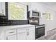 Modern kitchen featuring stainless steel appliances, black subway tile backsplash, and updated countertops at 4701 Flat Shoals Rd # 35E, Union City, GA 30291