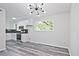 Bright kitchen with stainless steel appliances, subway tile backsplash, and hardwood floors at 4701 Flat Shoals Rd # 35E, Union City, GA 30291