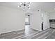 Spacious living room leading to a kitchen with stainless steel appliances and hardwood floors at 4701 Flat Shoals Rd # 35E, Union City, GA 30291
