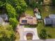 Aerial view showcasing the home, driveway, solar panels, backyard pool and lush landscaping at 522 Knollwood Dr, Stockbridge, GA 30281