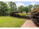 Serene backyard featuring a lush lawn, shed, and a tranquil pool area for relaxation and recreation at 522 Knollwood Dr, Stockbridge, GA 30281